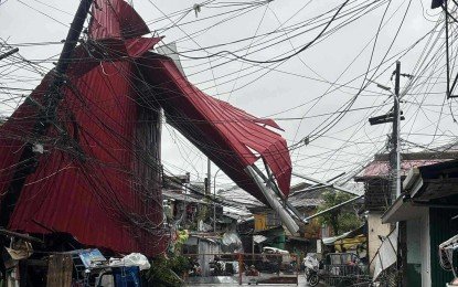 Damaged buildings and fallen power lines in Cebu after Typhoon Kalmaegi hit the Philippines.