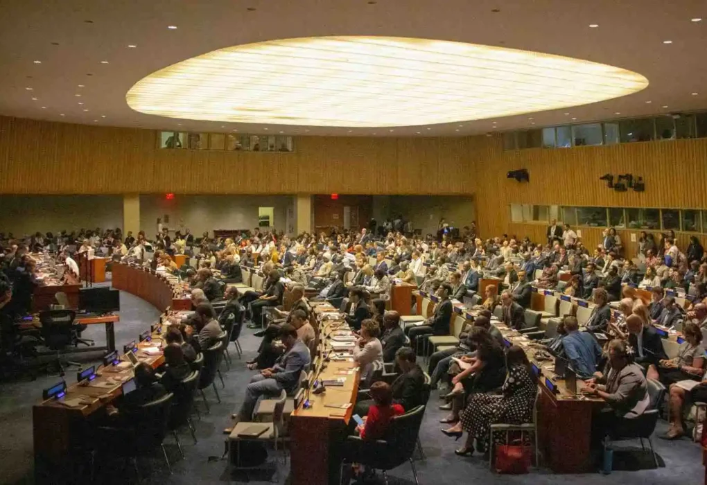 Delegates gather inside a United Nations meeting hall as the Security Council reviews and approves the Gaza stabilization plan.
