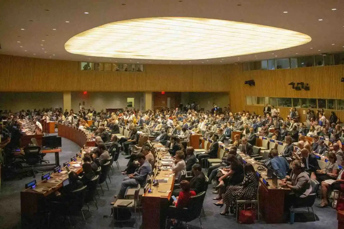 Delegates gather inside a United Nations meeting hall as the Security Council reviews and approves the Gaza stabilization plan.