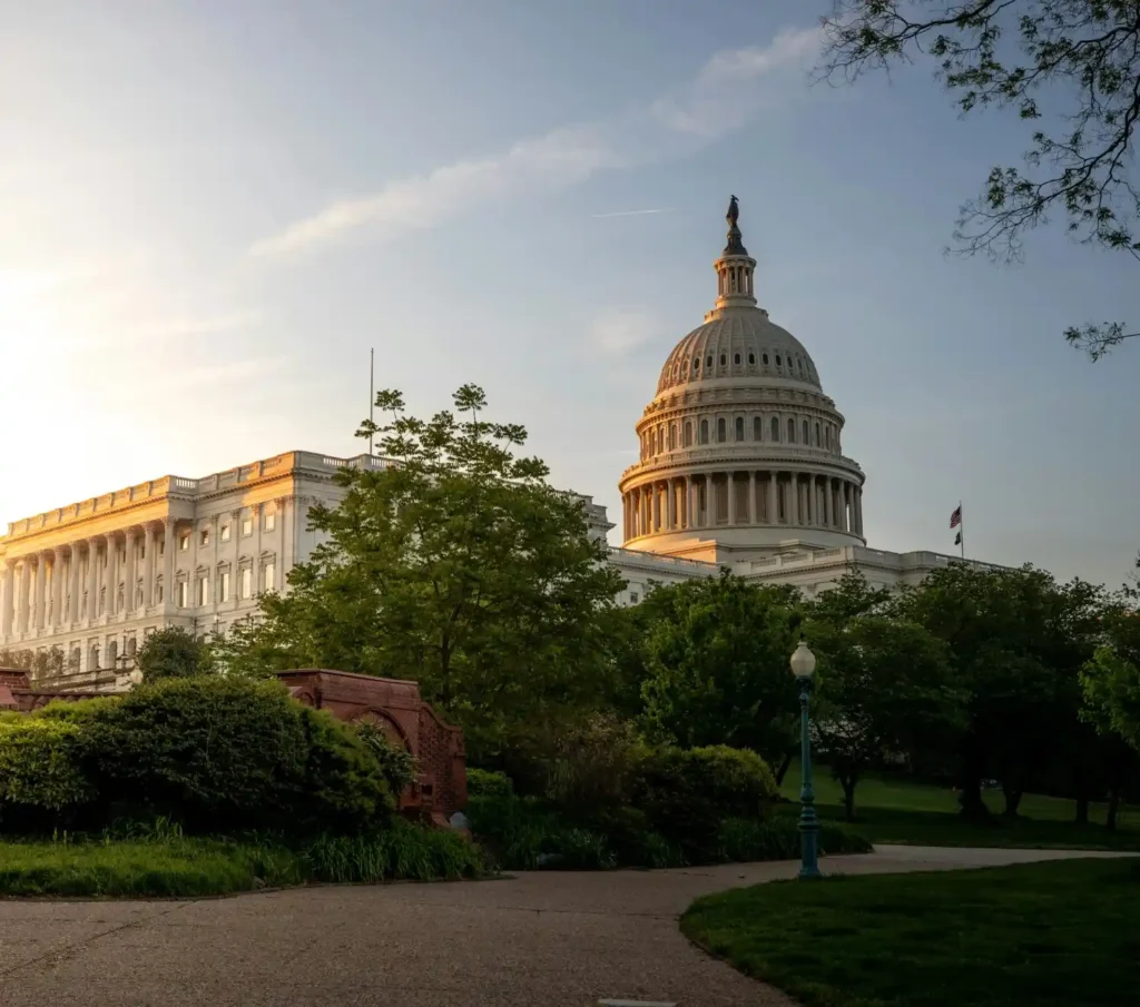 The United States Capitol building illuminated at dusk in Washington, D.C.