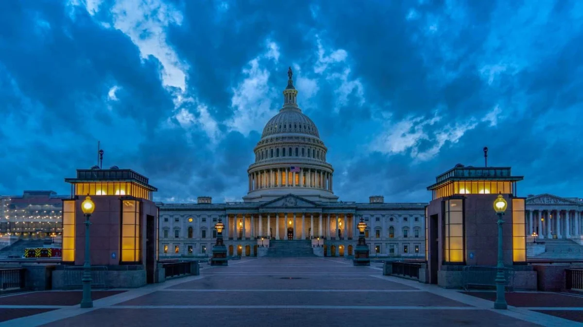 The U.S. Capitol Building illuminated at dusk in Washington, D.C., where lawmakers passed the spending bill.