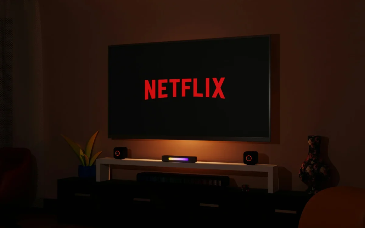 TV screen displaying the Netflix logo, representing the streaming giant’s proposed $72bn acquisition of Warner Bros Discovery and related antitrust scrutiny from the Trump administration.