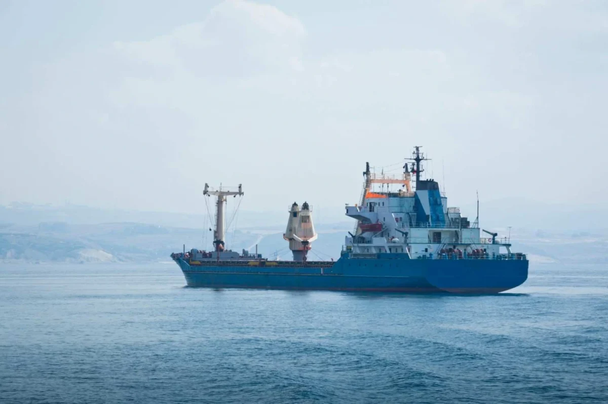 Commercial cargo ship sailing in open waters amid reports of US monitoring of a sanctioned oil tanker in the North Atlantic