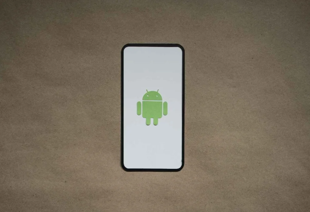Android smartphone displaying the Android logo on screen, representing devices running the Android operating system