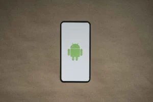 Android smartphone displaying the Android logo on screen, representing devices running the Android operating system