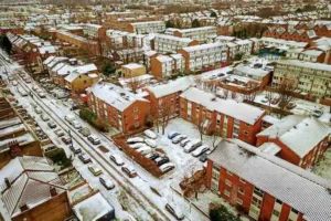Snow-covered residential neighborhood in the UK during winter cold weather (file photo).