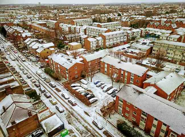 Snow-covered residential neighborhood in the UK during winter cold weather (file photo).