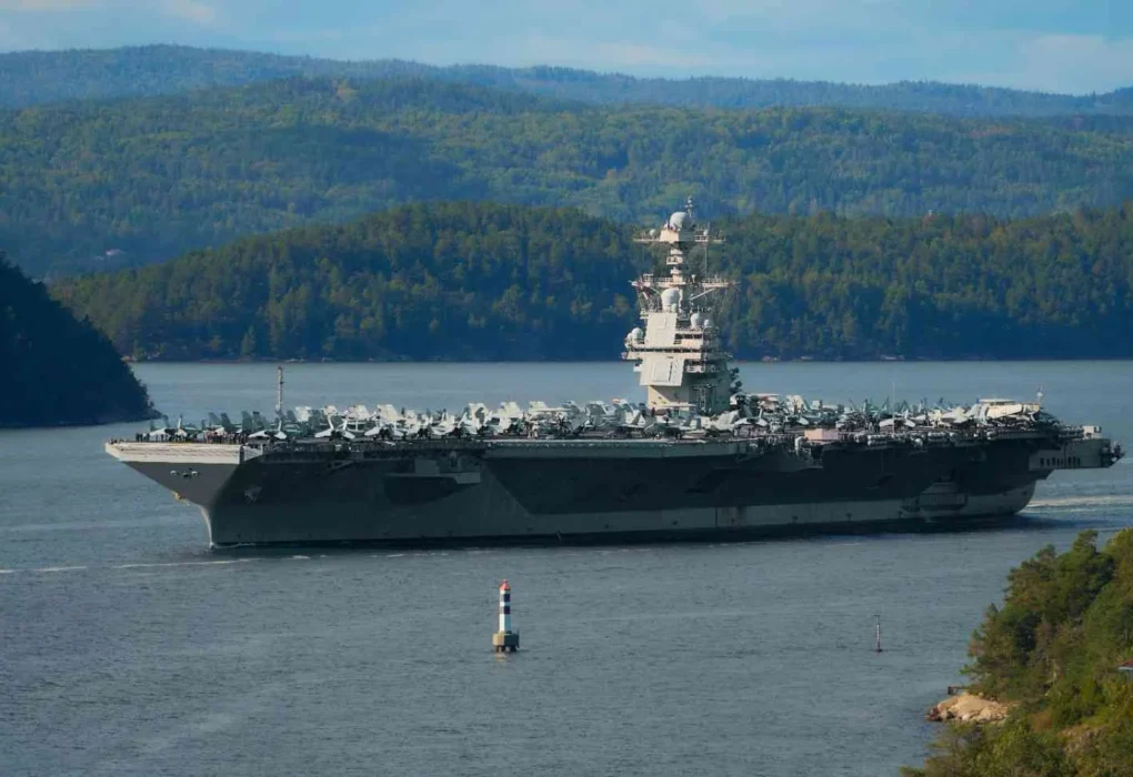 Stock image of a U.S. aircraft carrier with fighter jets on deck amid rising tensions between the United States and Iran