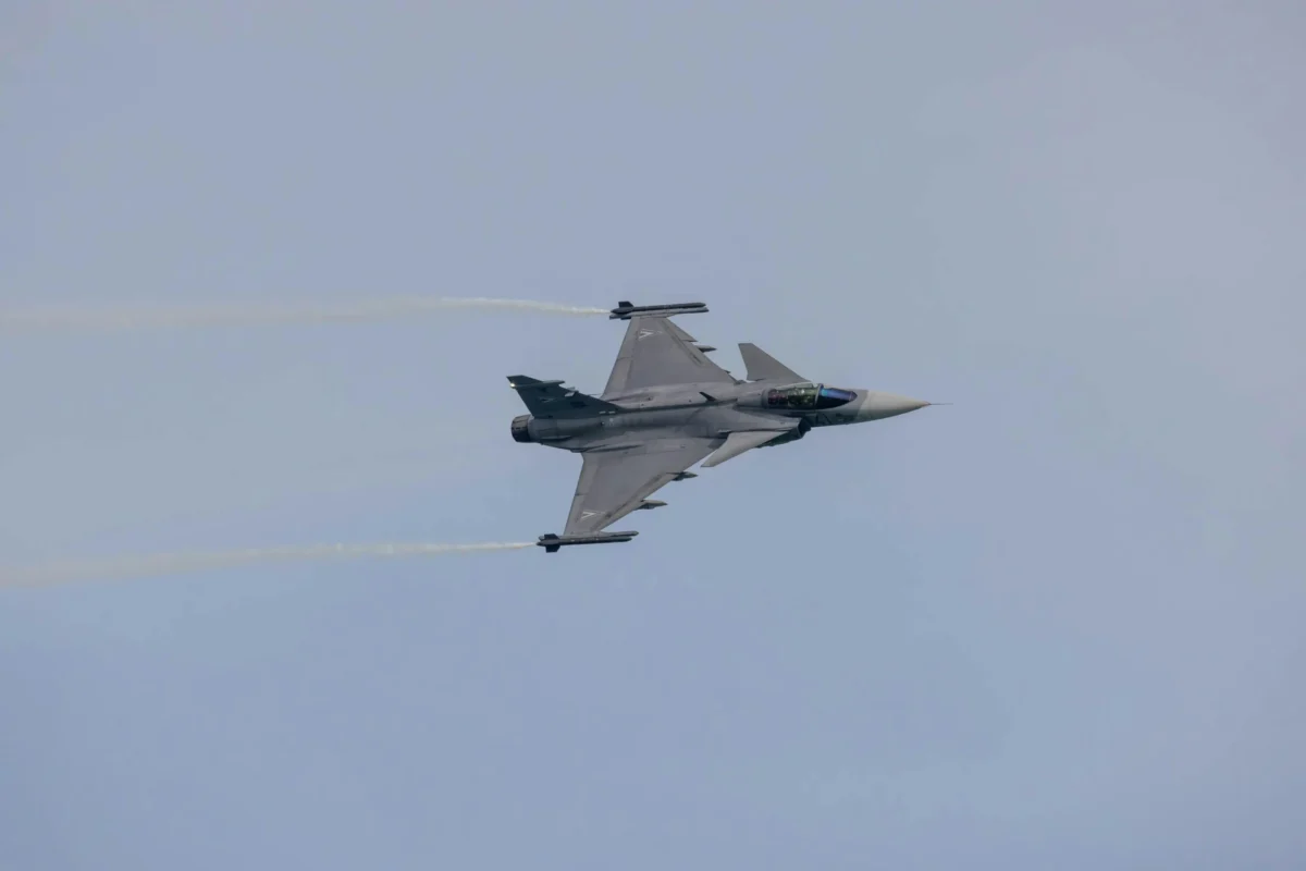 Fighter jet flying in clear sky during a military operation