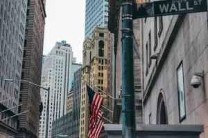 Wall Street street sign in New York’s Financial District representing the U.S. stock market and investor activity