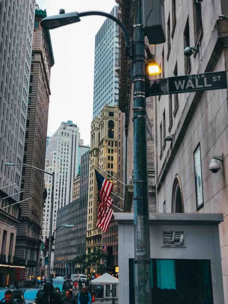Wall Street street sign in New York’s Financial District representing the U.S. stock market and investor activity